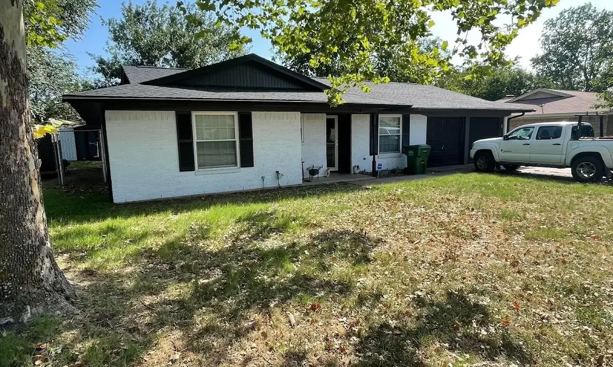 Professional roofing crew working on a residential roof in Sun City